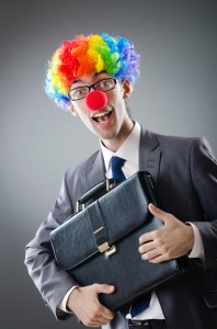 bigstock-Clown-businessman-in-funny-bus-23779583